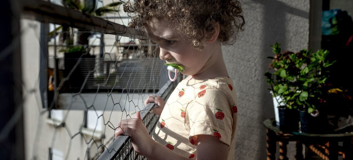 A three-year-old child at home in Lyon, France, during a COVID-19 lockdown. A three-year-old child at home in Lyon, France, during a COVID-19 lockdown.