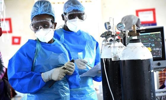 Doctors prepare oxygen cylinders for use in a COVID-19 ward at a hospital in Uganda. Doctors prepare oxygen cylinders for use in a COVID-19 ward at a hospital in Uganda.