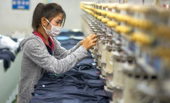 A female garment factory worker in Lao PDR. A female garment factory worker in Lao PDR.