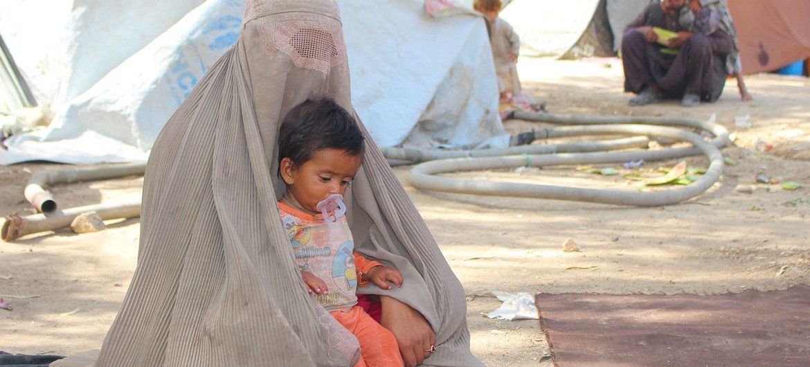 A mother and her child in the Haji camp for internally displaced people in Kandahar, Afghanistan. A mother and her child in the Haji camp for internally displaced people in Kandahar, Afghanistan.
