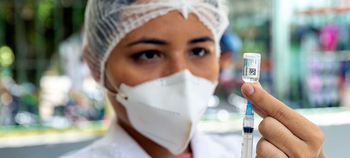 A nurse prepares to administer a COVID-19 vaccination northern Brazil. A nurse prepares to administer a COVID-19 vaccination northern Brazil.