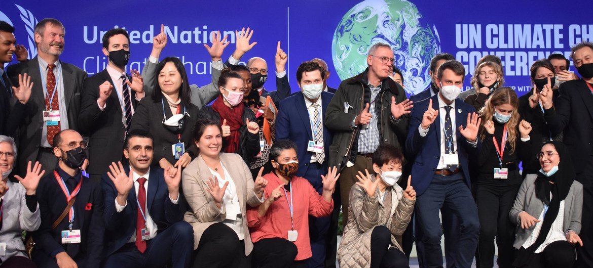 Negotiators marking the closing of the United Nations climate summit, COP26, which opened in Glasgow, Scotland, on 31 October. The conference sought new global commitments to tackle climate change. Negotiators marking the closing of the United Nations climate summit, COP26, which opened in Glasgow, Scotland, on 31 October. The conference sought new global commitments to tackle climate change.