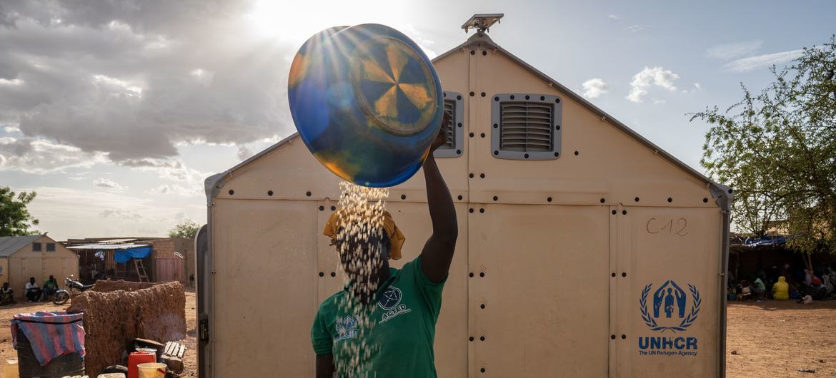 An internally displaced woman prepares food for her family in Burkina Faso. An internally displaced woman prepares food for her family in Burkina Faso.