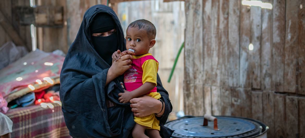 An infant eats supplementary food at a World Food Programme distribution point in Mokha, Yemen. An infant eats supplementary food at a World Food Programme distribution point in Mokha, Yemen.