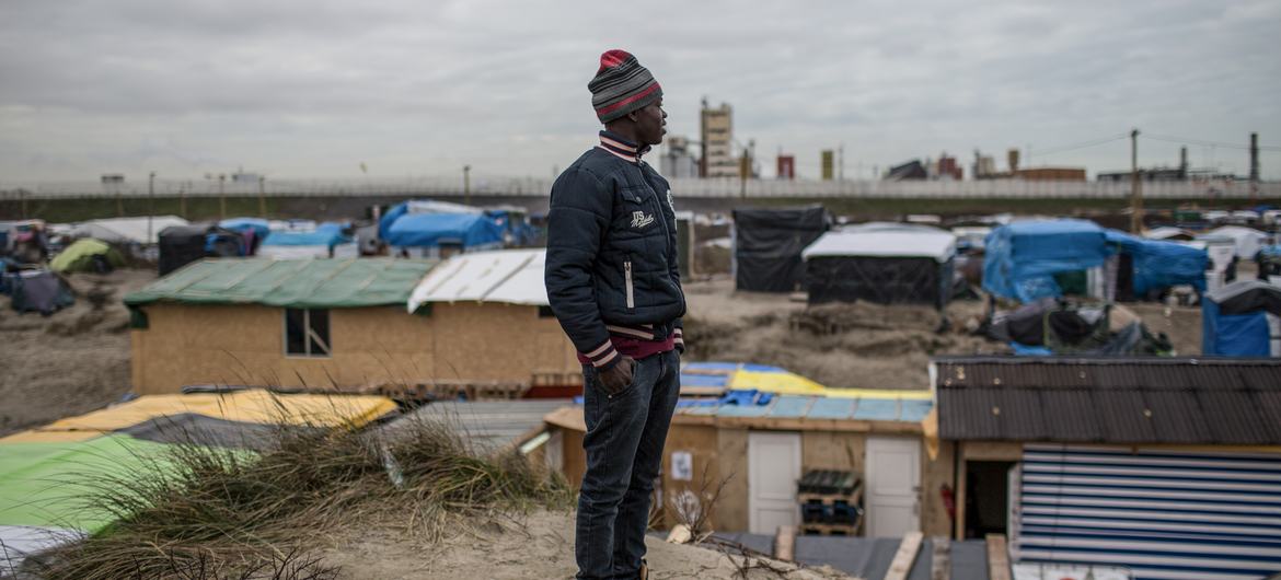 A young migrant from Darfur waits to reach England from Calais, France. A young migrant from Darfur waits to reach England from Calais, France.