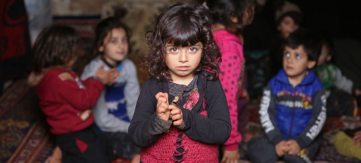 A displaced girl stands among other children inside an underground cave where families were sheltering in Taltouna village, in the northwestern city of Idlib, Syria (file photo). A displaced girl stands among other children inside an underground cave where families were sheltering in Taltouna village, in the northwestern city of Idlib, Syria (file photo).