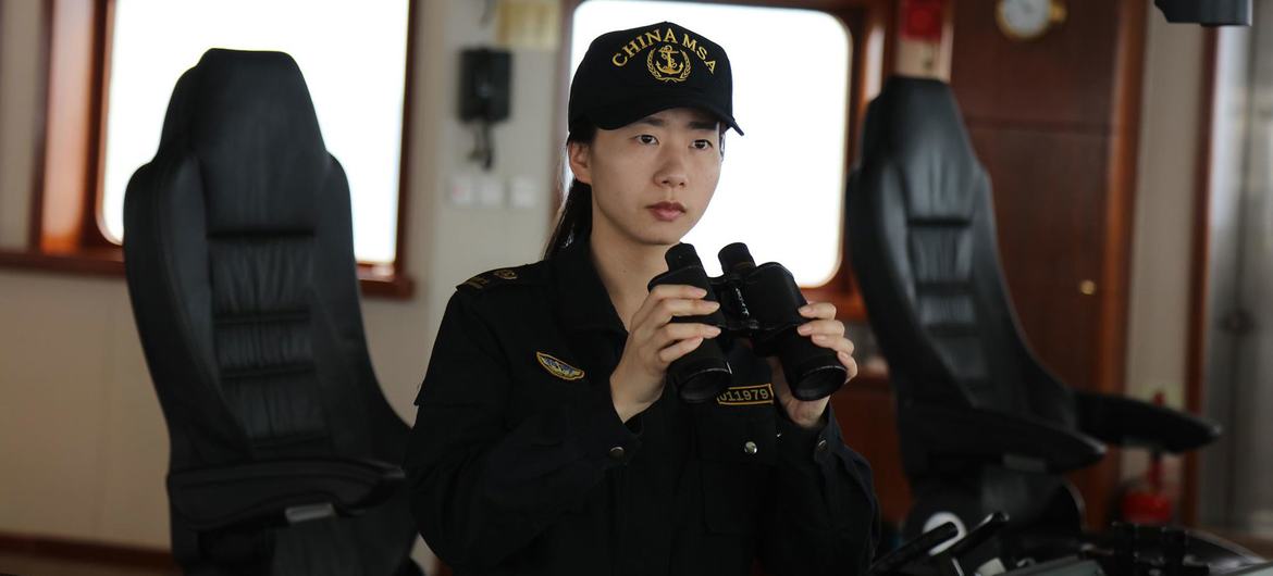 A trainee chief mate pilots a ship in China. A trainee chief mate pilots a ship in China.