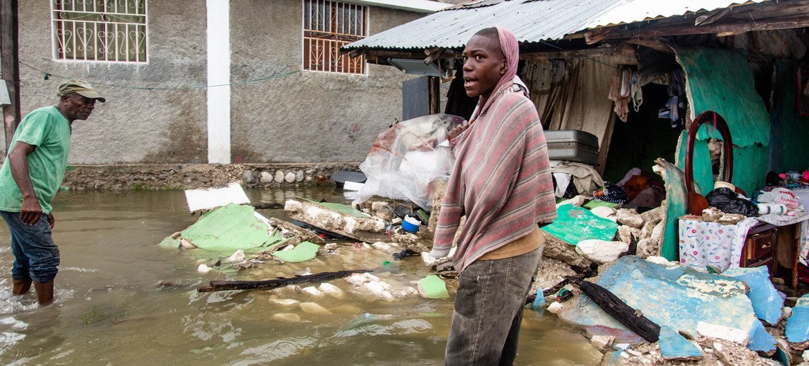 A young man stands outside a row of buildings destroyed by a 7.2 magnitude earthquake in Haiti followed by a storm surge from Tropical Depression Grace. A young man stands outside a row of buildings destroyed by a 7.2 magnitude earthquake in Haiti followed by a storm surge from Tropical Depression Grace.