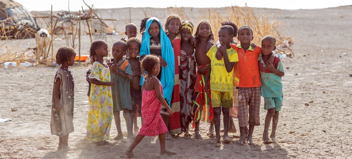 Children displaced by conflict and drought pose for a photo n Semera, Afar Region, Ethiopia. Children displaced by conflict and drought pose for a photo n Semera, Afar Region, Ethiopia.
