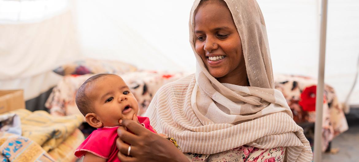 An Ethiopian mother and her child live with six other family members in a small hut at the Um Rakuba Refugee camp in eastern Sudan. An Ethiopian mother and her child live with six other family members in a small hut at the Um Rakuba Refugee camp in eastern Sudan.
