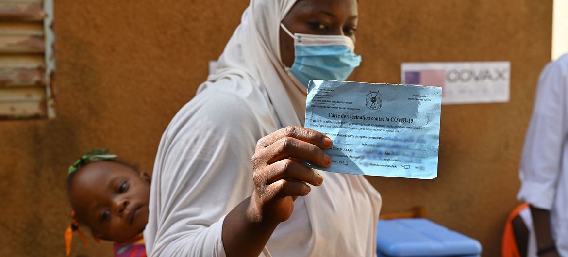 A woman is vaccinated against COVID-19 at a health centre in the Obassin region of Burkina Faso. A woman is vaccinated against COVID-19 at a health centre in the Obassin region of Burkina Faso.