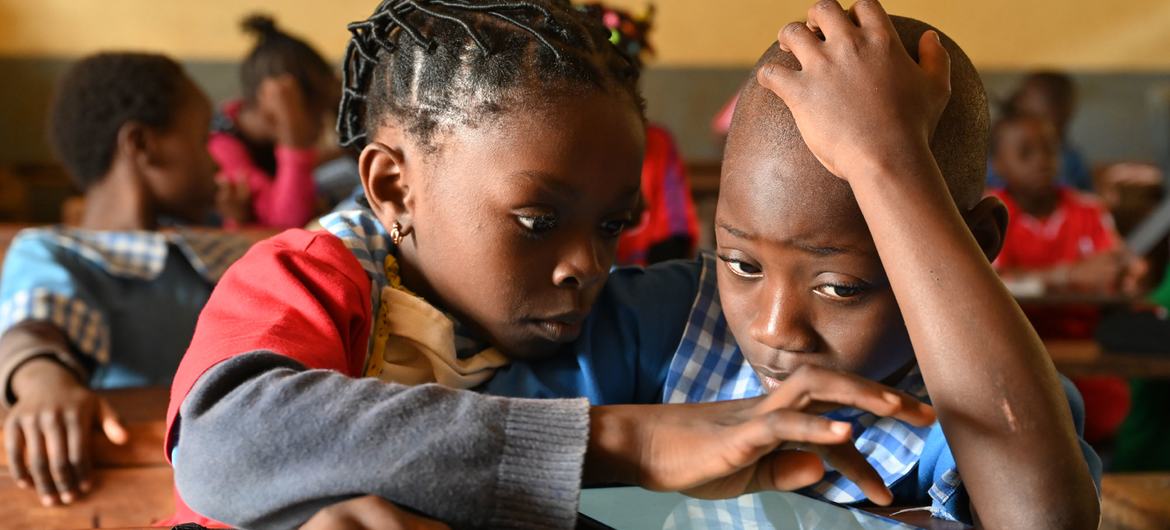 Children learn with tablets and computers at a school in Yaoundé, Cameroon. Children learn with tablets and computers at a school in Yaoundé, Cameroon.