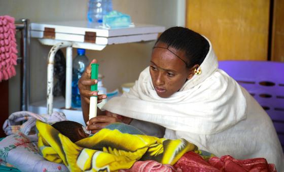 A mother feeds her severely malnourished baby at a clinic Ethiopia. A mother feeds her severely malnourished baby at a clinic Ethiopia.