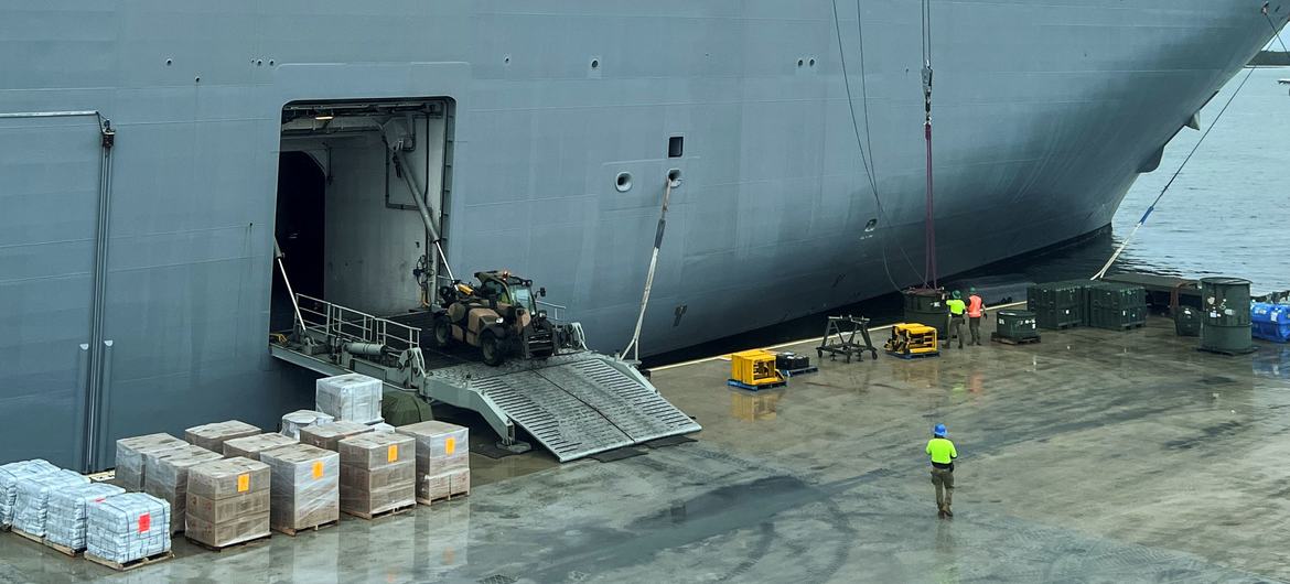 Workers load the HMAS Adelaide ship with emergency supplies dedicated to Tonga Islands in response to the eruption of the Hunga-Tonga-Hunga-Ha'apai underwater volcano. Workers load the HMAS Adelaide ship with emergency supplies dedicated to Tonga Islands in response to the eruption of the Hunga-Tonga-Hunga-Ha'apai underwater volcano.