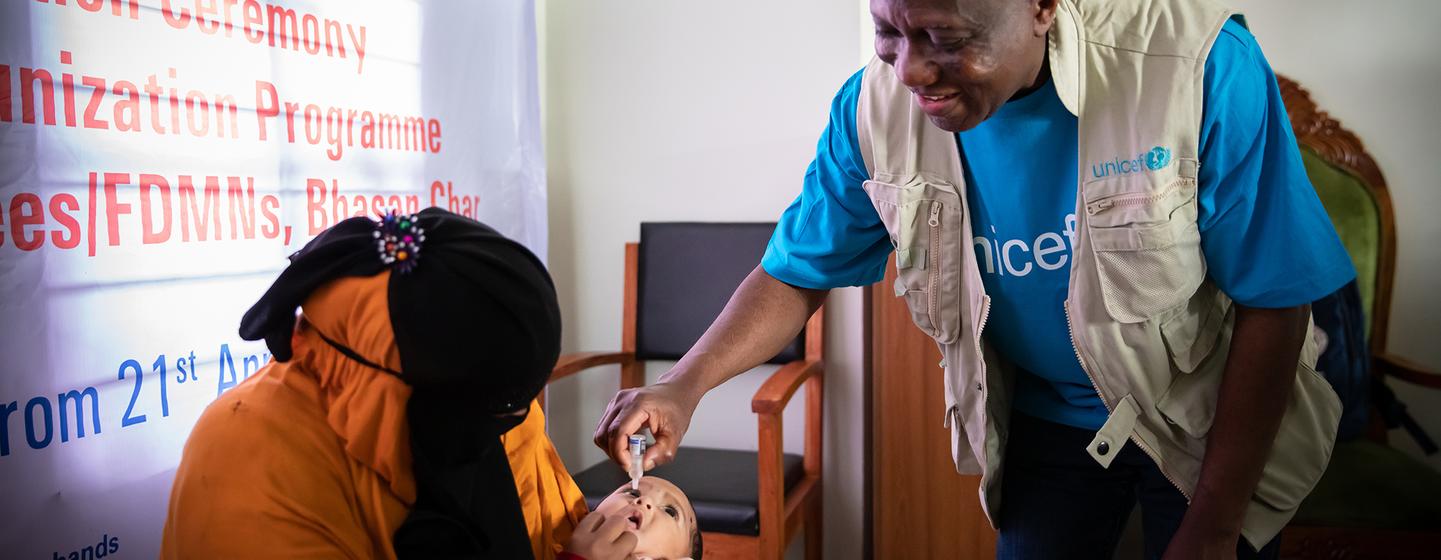 George Laryea-Adjei, UNICEF Regional Director for South Asia, inoculates a Rohingya refugee baby with the polio vaccine George Laryea-Adjei, UNICEF Regional Director for South Asia, inoculates a Rohingya refugee baby with the polio vaccine