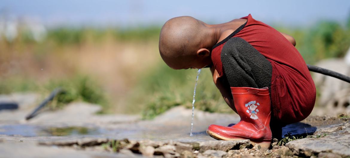 A child drinks water from the only source in Hesbi Camp in Saida, Lebanon. A child drinks water from the only source in Hesbi Camp in Saida, Lebanon.