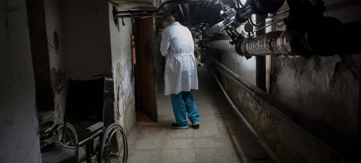 A doctor walks in a basement used to hide patients during air raids, at the Central District Hospital in Brovary, Ukraine. A doctor walks in a basement used to hide patients during air raids, at the Central District Hospital in Brovary, Ukraine.