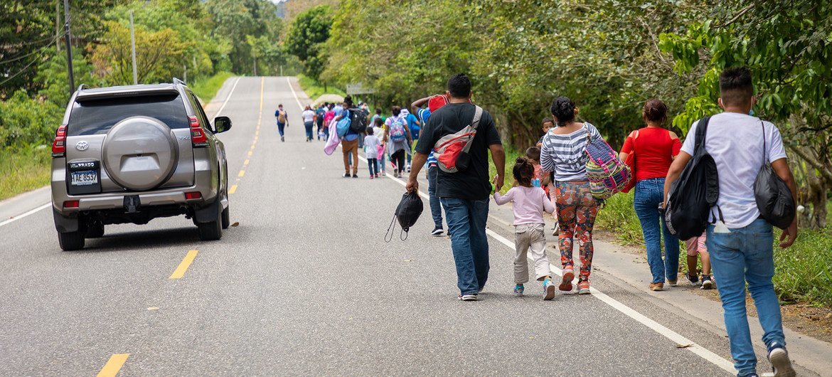 Migrant families in Honduras walk to the Guatemalan border. Migrant families in Honduras walk to the Guatemalan border.