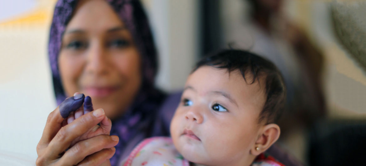 A mother holds up hers and her daughter's inked fingers at a polling station in the eastern city of Benghazi after casting her vote in historic elections. The proud display of inked fingers became a fad for many Libyans stressing their newfound right to vote. A mother holds up hers and her daughter's inked fingers at a polling station in the eastern city of Benghazi after casting her vote in historic elections. The proud display of inked fingers became a fad for many Libyans stressing their newfound right to vote.