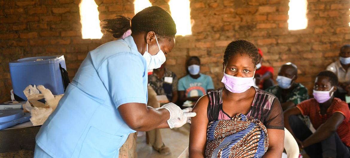 A woman receives her second dose of the COVID-19 vaccine at a church in Kasungu, Malawi. A woman receives her second dose of the COVID-19 vaccine at a church in Kasungu, Malawi.