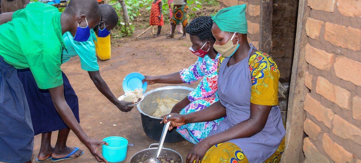 Students receive meals at a school in northern Uganda. Students receive meals at a school in northern Uganda.