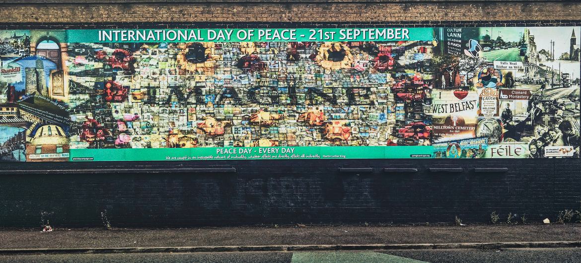 A mural on the Peace Wall in West Belfast, Northern Ireland. A mural on the Peace Wall in West Belfast, Northern Ireland.
