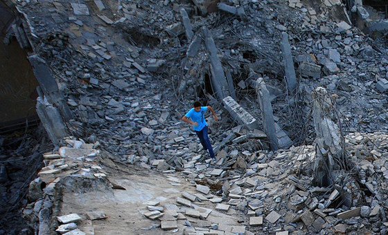 A boy runs in the ruins of the Bab al-Aziziyah compound in Tripoli, Libya. A boy runs in the ruins of the Bab al-Aziziyah compound in Tripoli, Libya.