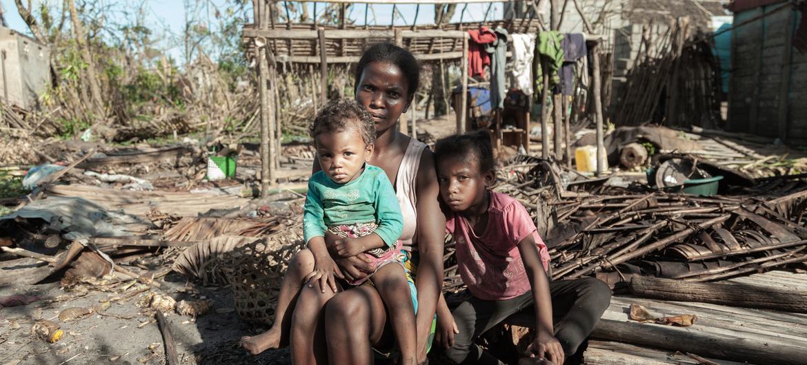 A woman and her two young daughters sit next to what is left of their house in the aftermath of Cyclone Batsirai in Madagascar. A woman and her two young daughters sit next to what is left of their house in the aftermath of Cyclone Batsirai in Madagascar.