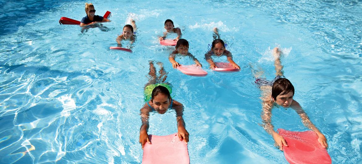 Children learn water safety skills. Children learn water safety skills.