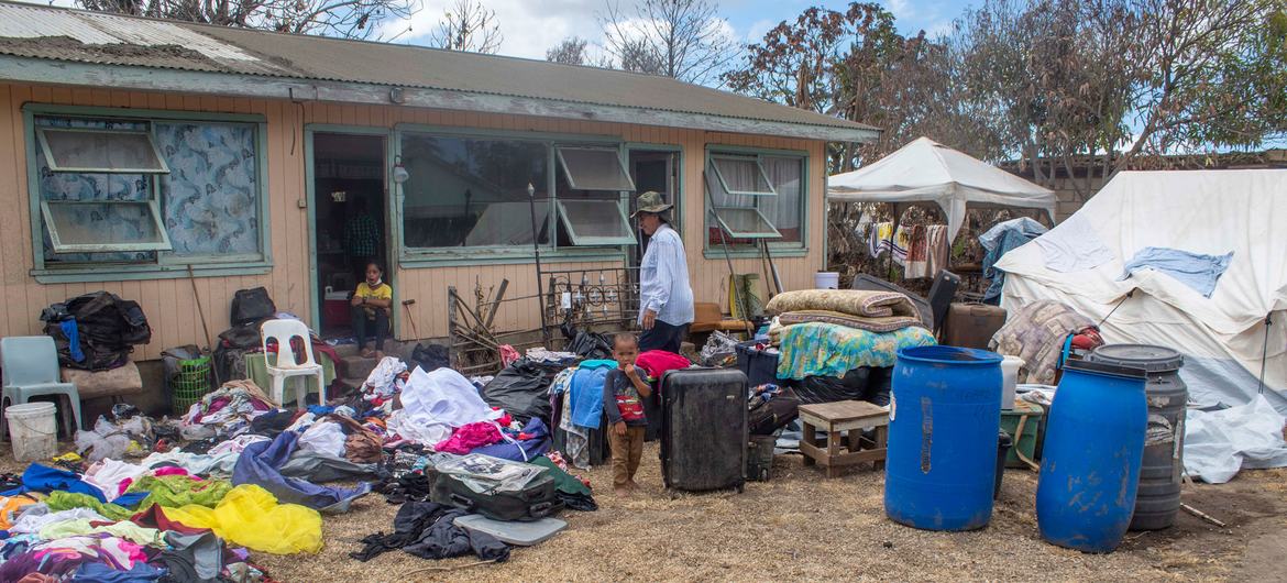 A family dry their belongings outside their home after it was damaged in the Hunga Tonga-Hunga Ha’apai underwater volcano eruption and tsunami. A family dry their belongings outside their home after it was damaged in the Hunga Tonga-Hunga Ha’apai underwater volcano eruption and tsunami.