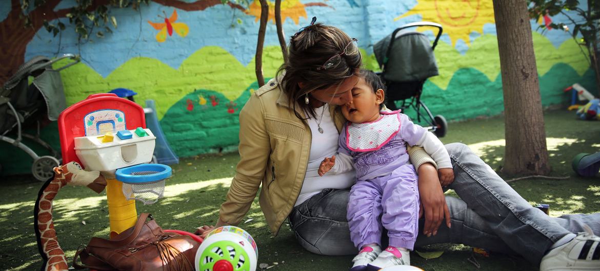 Mother kisses her daughter at the Catalina Home in Santiago, Chile. Mother kisses her daughter at the Catalina Home in Santiago, Chile.