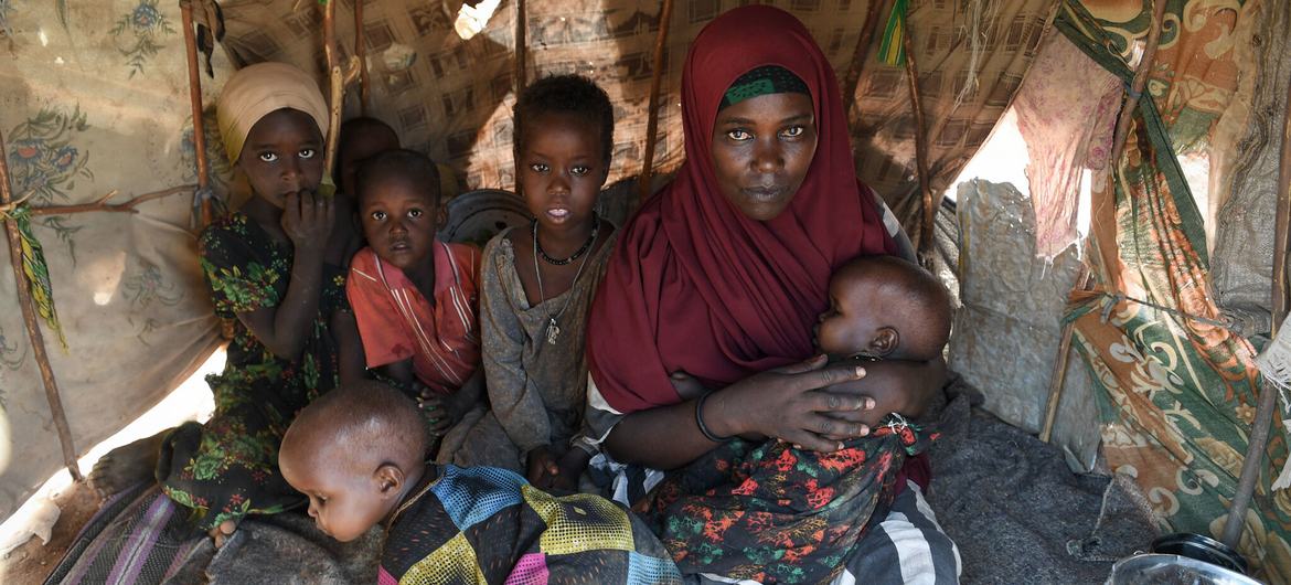 A mother and her five children inside their makeshift shelter at a camp for Internally Displaced Persons (IDPs) in Luuq, Somalia on 21 March 2022. A mother and her five children inside their makeshift shelter at a camp for Internally Displaced Persons (IDPs) in Luuq, Somalia on 21 March 2022.