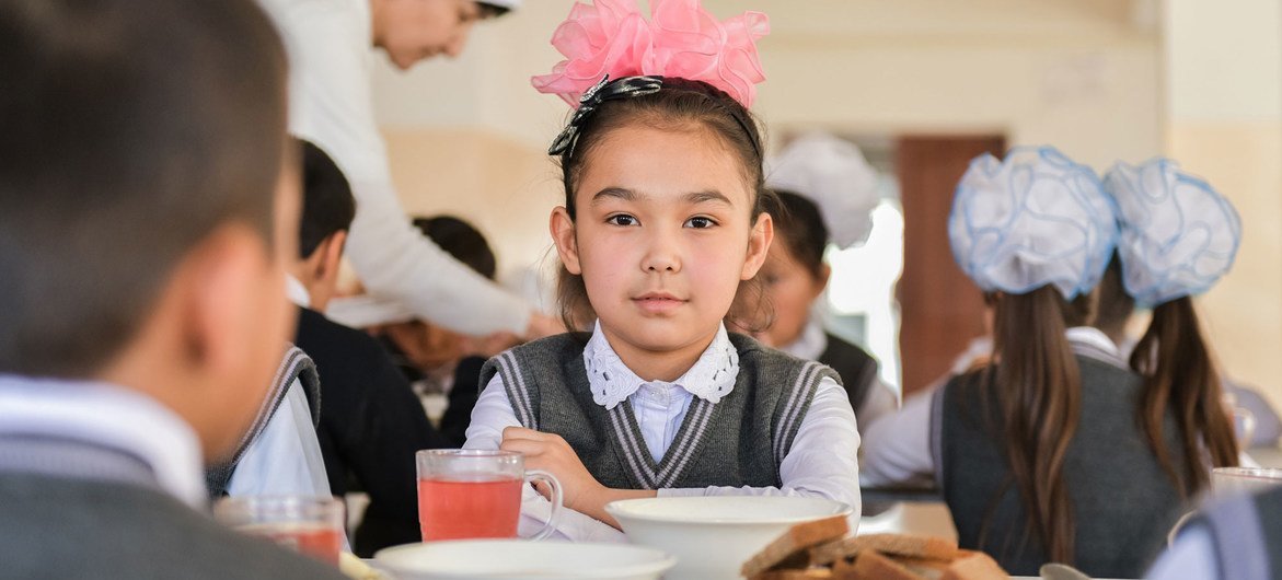 A 9-year-old girl eats lunch at a primary school in Turkestan city, Kazakhstan. A 9-year-old girl eats lunch at a primary school in Turkestan city, Kazakhstan.