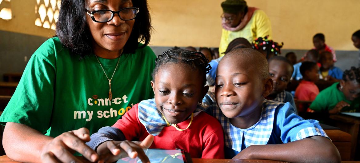 Young girls at a school in Yaoundé, the capital of Cameroon use a tablet during a lesson. Young girls at a school in Yaoundé, the capital of Cameroon use a tablet during a lesson.