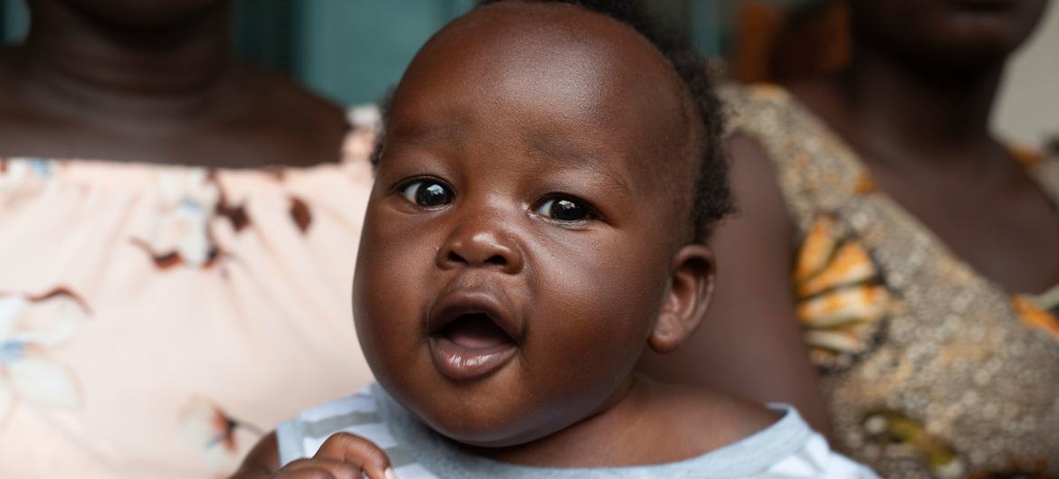 Amin Muktar, 4 months, sits in his mother’s lap, while waiting to receive polio and pentavalent vaccines at Nyakuron Primary Health Care Centre in Juba, South Sudan. Amin Muktar, 4 months, sits in his mother’s lap, while waiting to receive polio and pentavalent vaccines at Nyakuron Primary Health Care Centre in Juba, South Sudan.