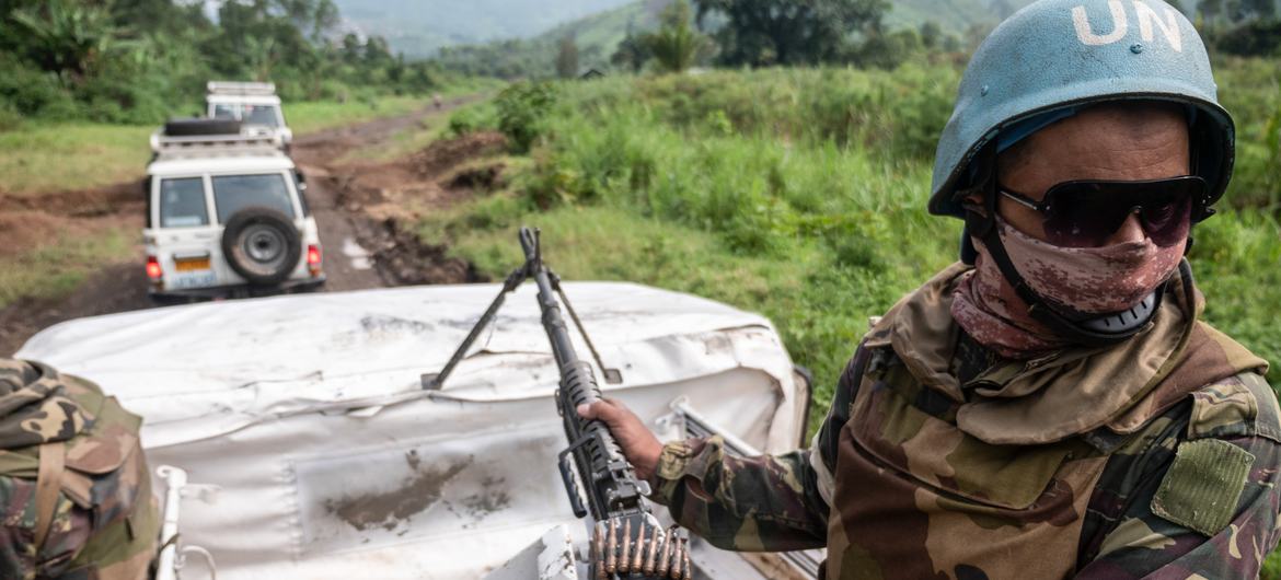 Peacekeepers escort a humanitarian convoy to the village of Pinga in North Kivu, Democratic Republic of the Congo. Peacekeepers escort a humanitarian convoy to the village of Pinga in North Kivu, Democratic Republic of the Congo.