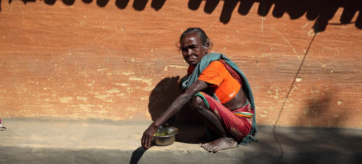 An elderly woman has her lunch in the sun at Adibasi Sahi, India. The extreme heat is impacting hundreds of millions of people in the country. An elderly woman has her lunch in the sun at Adibasi Sahi, India. The extreme heat is impacting hundreds of millions of people in the country.