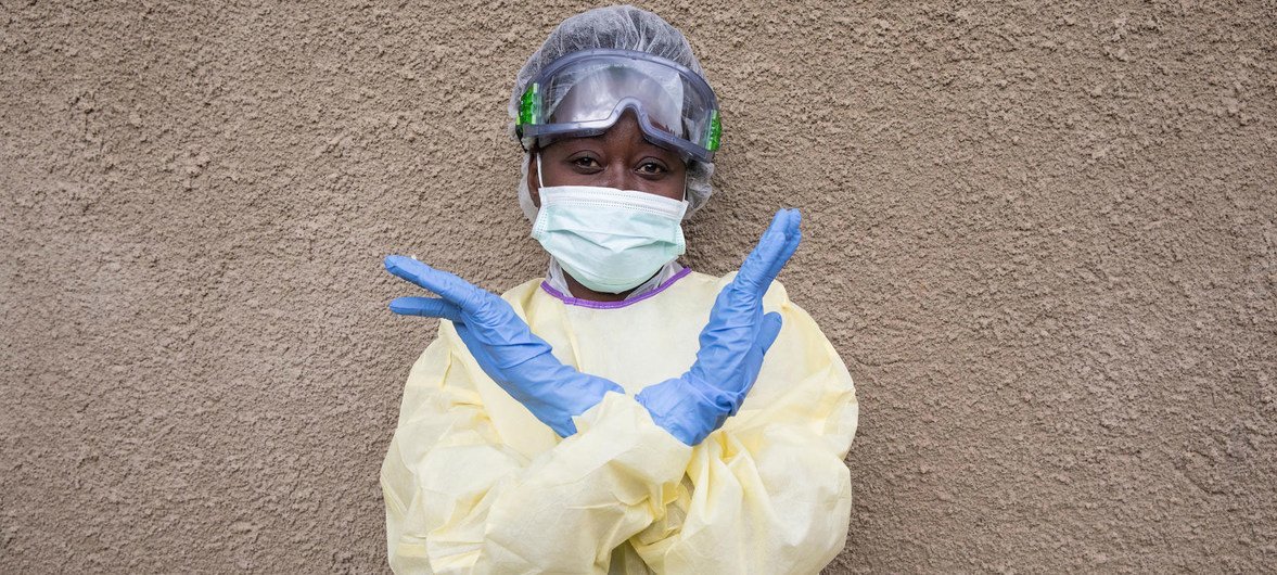 An Ebola health worker signals that people in the Democratic Republic of the Congo should not be scared of doctors but rather the deadly disease itself. (August 2019) An Ebola health worker signals that people in the Democratic Republic of the Congo should not be scared of doctors but rather the deadly disease itself. (August 2019)
