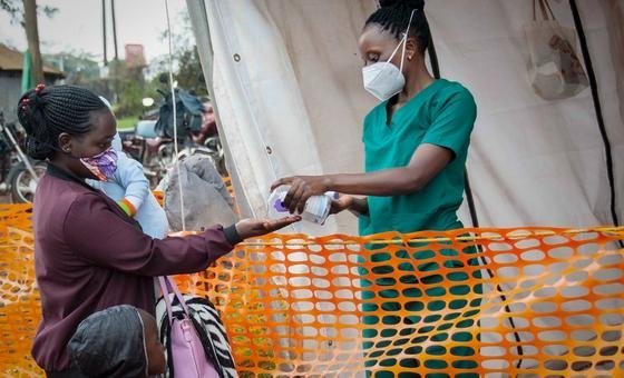A nurse dispenses hand sanitizer to a visitor at a hospital in Masaka, Uganda. A nurse dispenses hand sanitizer to a visitor at a hospital in Masaka, Uganda.