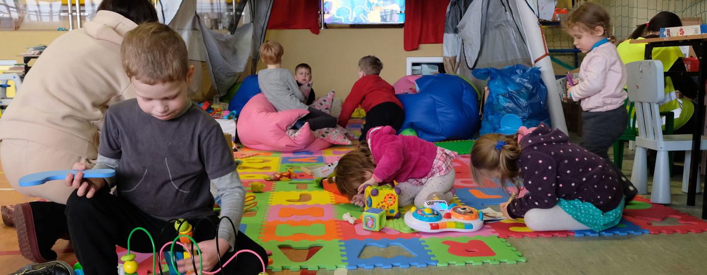 Children learn and play in the corner of a school gymnasium in Poland, set up to host refugee families who have fled the war in Ukraine. Children learn and play in the corner of a school gymnasium in Poland, set up to host refugee families who have fled the war in Ukraine.