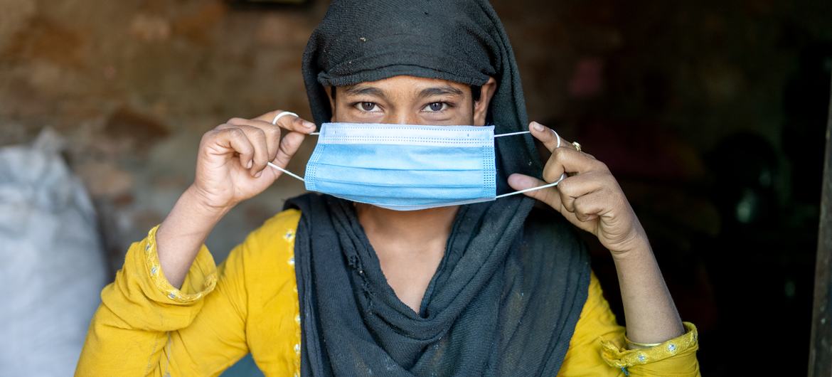 A woman wears a face mask in Rajasthan, India. A woman wears a face mask in Rajasthan, India.