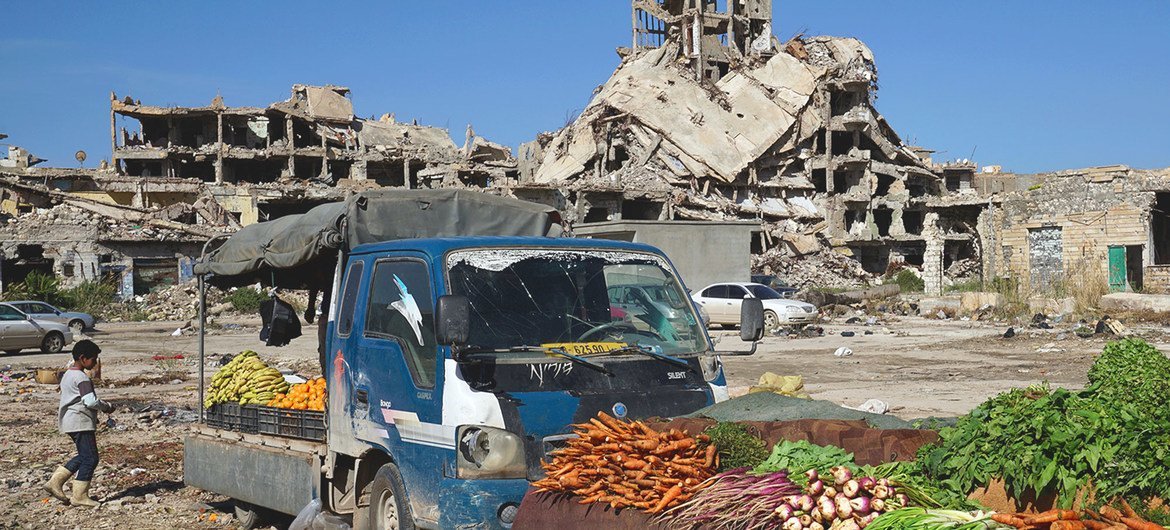 Vegetables are sold amidst the rubble of the old town of Benghazi in Libya. Vegetables are sold amidst the rubble of the old town of Benghazi in Libya.