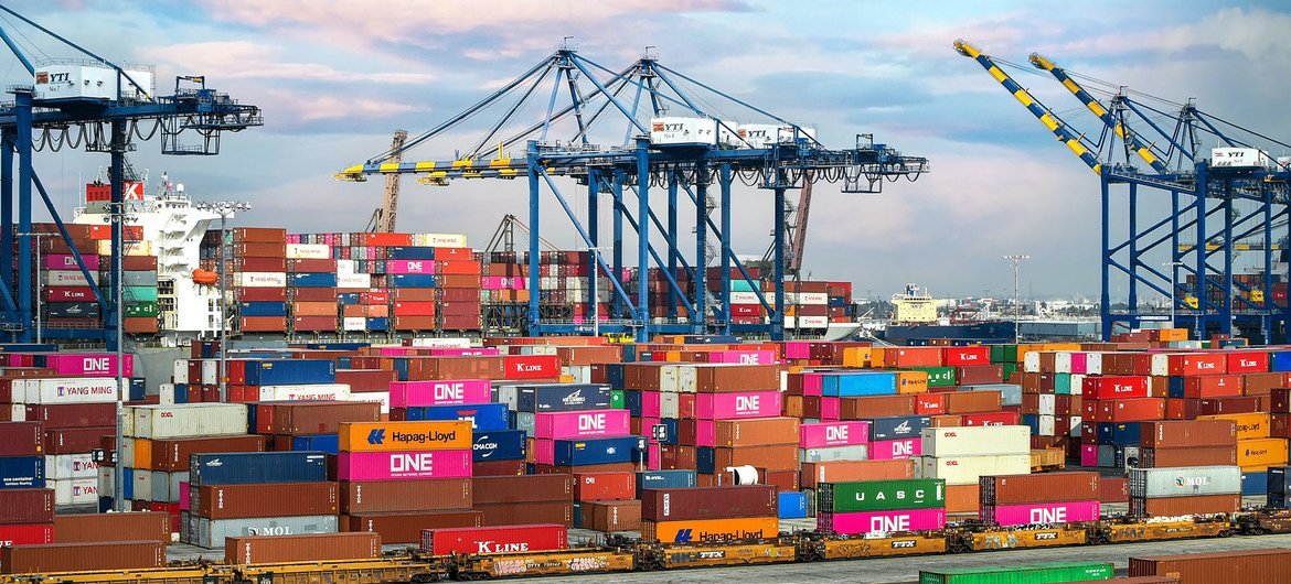 Shipping containers are loaded onto vessels at a port in Los Angeles, USA. Shipping containers are loaded onto vessels at a port in Los Angeles, USA.