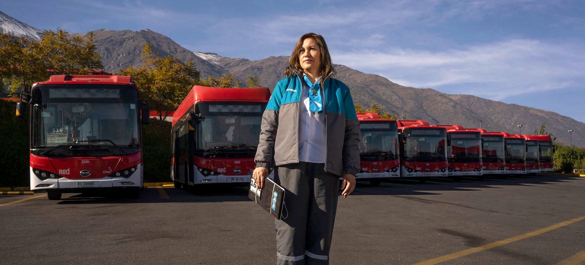 A worker at an electric bus charging terminal in Santiago, Chile. A worker at an electric bus charging terminal in Santiago, Chile.