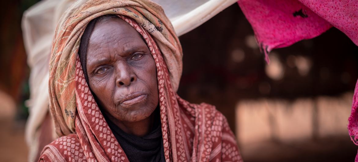 Elderly woman in a makeshift IDP camp in Somalia. Elderly woman in a makeshift IDP camp in Somalia.