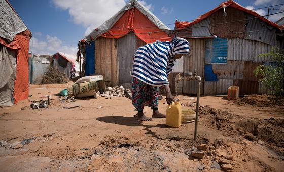 A young girl collects water in Mogadishu, Somalia. A young girl collects water in Mogadishu, Somalia.