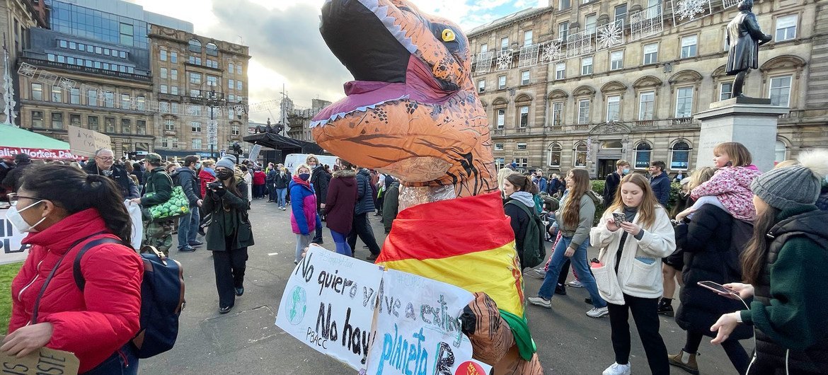 Activist dressed as dinosaur character takes part in demonstrations at the COP26 Climate Conference in Glasgow, Scotland. Activist dressed as dinosaur character takes part in demonstrations at the COP26 Climate Conference in Glasgow, Scotland.