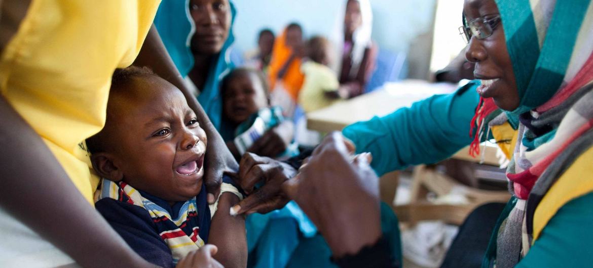 A child receives a vaccination against meningitis at the community centre in Al Neem camp for Internally Displaced People in El Daein, East Darfur, Sudan. A child receives a vaccination against meningitis at the community centre in Al Neem camp for Internally Displaced People in El Daein, East Darfur, Sudan.