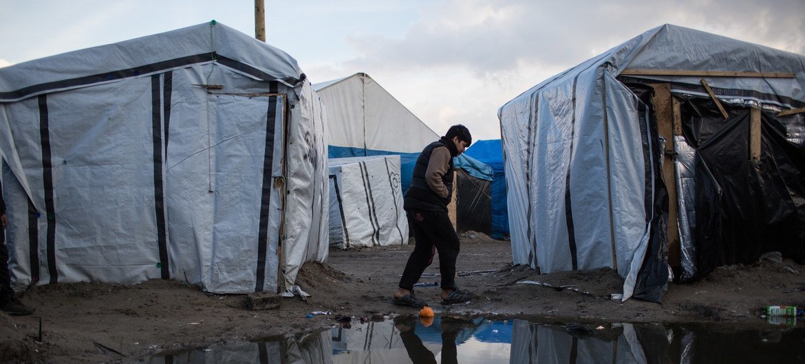 A boy walks through a migrant camp in Calais, northern France, hoping to enter the United Kingdom. (file) A boy walks through a migrant camp in Calais, northern France, hoping to enter the United Kingdom. (file)