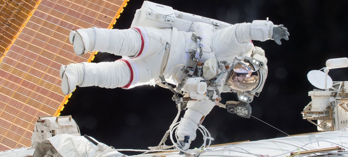 NASA astronaut Scott Kelly is seen floating during a spacewalk on 21  December 2015 as he and fellow astronaut Tim Kopra released brake handles on crew equipment carts on either side of the space station.